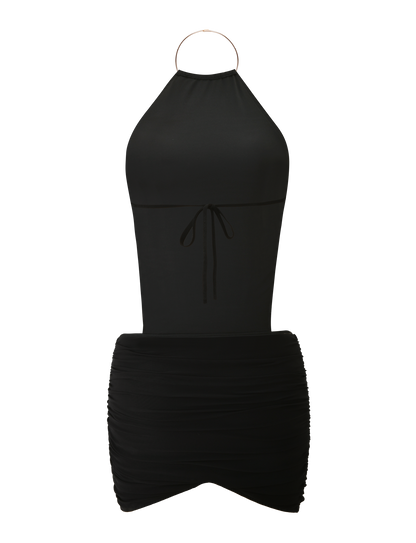 The EVANNA MINI DRESS by TIGERMIST is a sleeveless black mini dress featuring a gold neck ring, waist tie, ruched skirt, high neck, and an elegant open back for standout style.